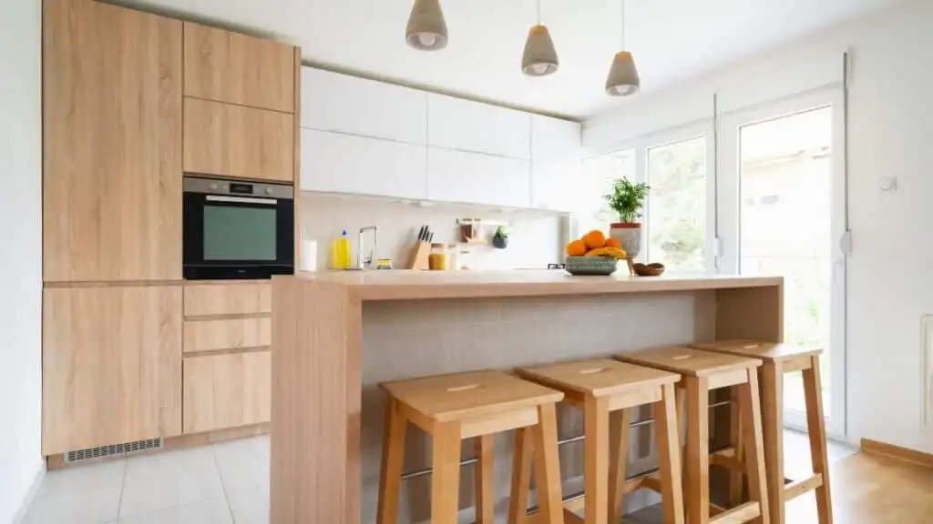 Residential cleaning team maintaining a modern kitchen for local homeowners